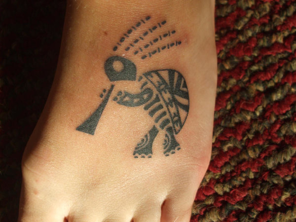 Kylie - kokopelli turtle tattoo